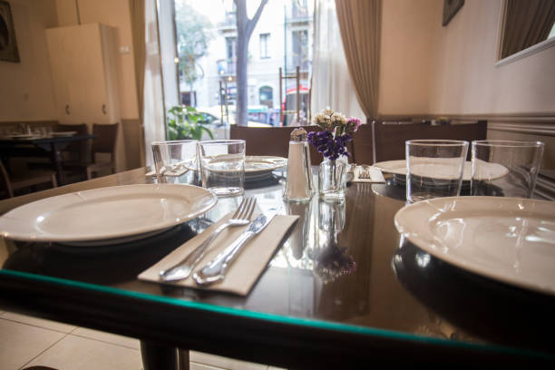 istock Elegant restaurant table with cutlery, crockery and glasses. 1460446234