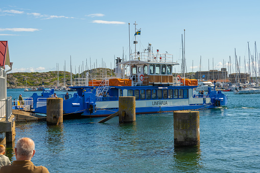 Kungälv, Sweden - July 15 2022: Cable ferry Lasse-Maja crossing between Marstrand and the mainland.