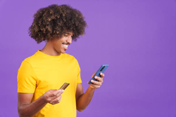 istock African man using the mobile and card to shopping online 1460448913