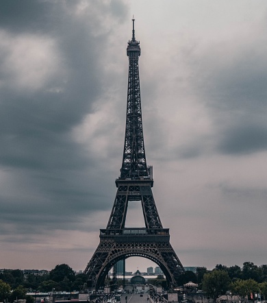 Paris, France – August 17, 2022: A vertical shot of the Eiffel Tower in Paris, France on a cloudy day