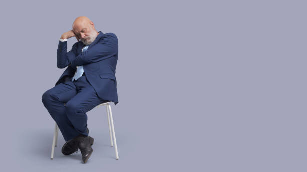 istock Corporate businessman sleeping on a chair 1460451900