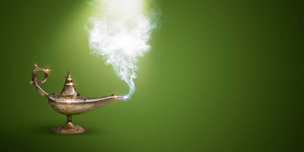 istock Golden magic lamp on green background 1460454001