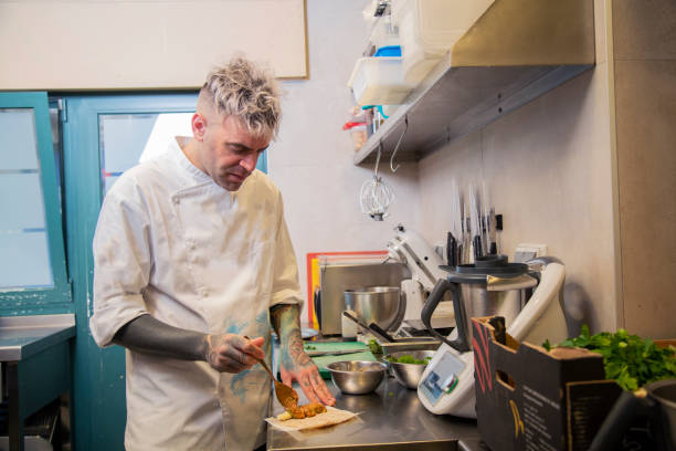 istock Chef cooking food at a restaurant kitchen 1460459219
