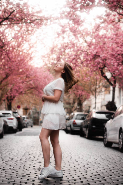 istock Girl in cherry blossom 1460460709