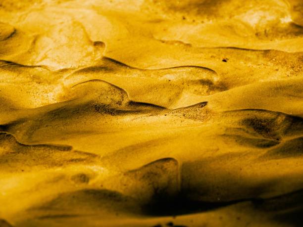 A closeup shot of a textured golden surface for backgrounds