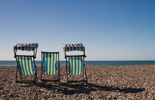 istock View of the lounge chairs by the beach 1460461675