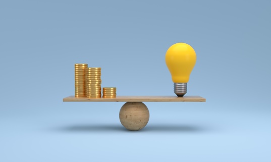 Coin stack compare light bulb idea on wood scale seesaw on blue background. financial investment, saving money, think exchange to money concept. 3d illustration