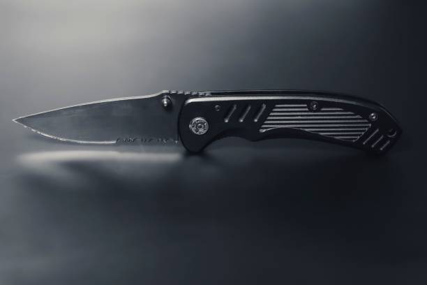 istock Every day carry pocket folding knife on black background. 1460462857
