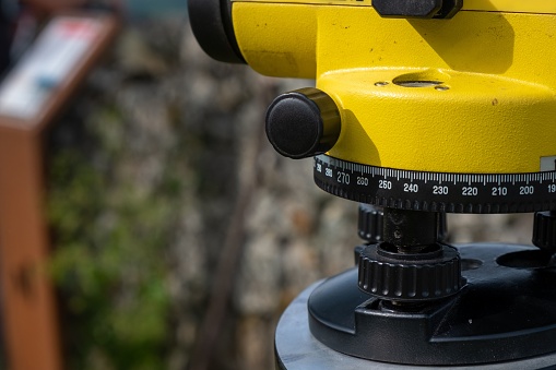 theodolite in an archaeological excavation, topographic tool for measuring elevations. Close up