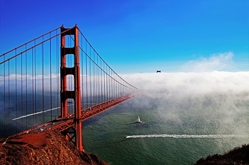 A charming view of the Golden Gate Bridge with a sea fog in the background, San Francisco, USA