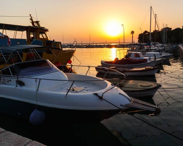 istock Boats in a harbor at sunset 1460464443
