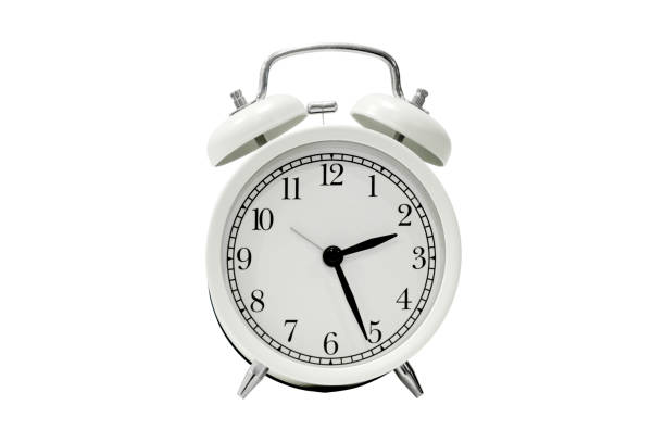 istock White alarm clock with black dial, isolated on a white background 1460464673