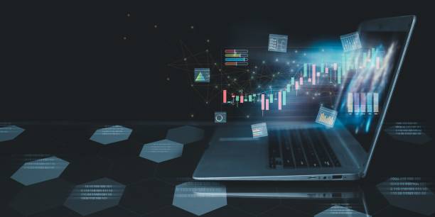 istock Various fintech graphs, stock changes report coming out of a laptop screen 1460464855