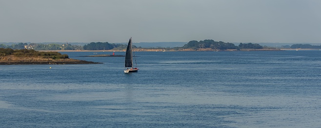 Brittany, panorama of the Morbihan gulf, view from the Ile aux Moines island, with a sailboat