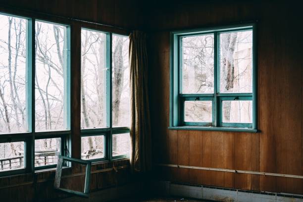 istock Interior of an abandoned building with broken windows 1460470855