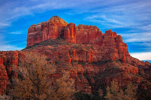 An aerial view of red canyon under blue sky