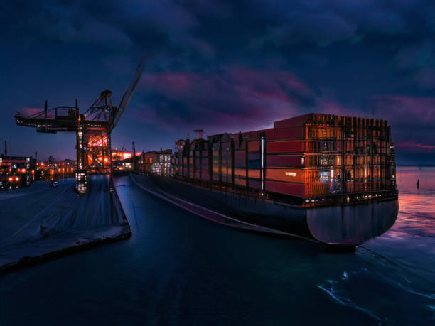 Aerial view of cargo ship in transit at night.