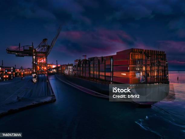 Aerial View Of Cargo Ship In Transit At Night Stock Photo - Download Image Now - Cargo Container, Container Ship, Sea