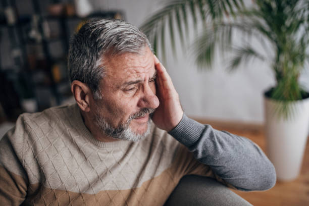 istock Worried senior sitting at home alone 1460473709