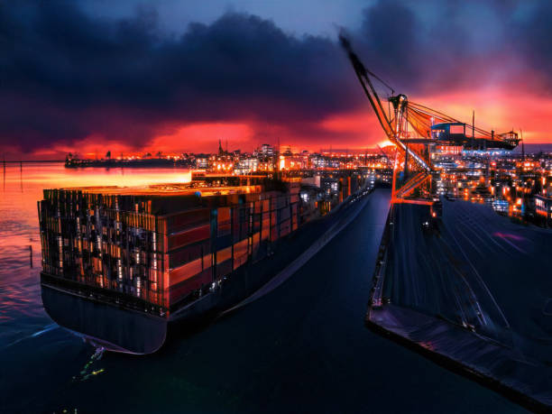 Aerial view of cargo ship in transit at night.