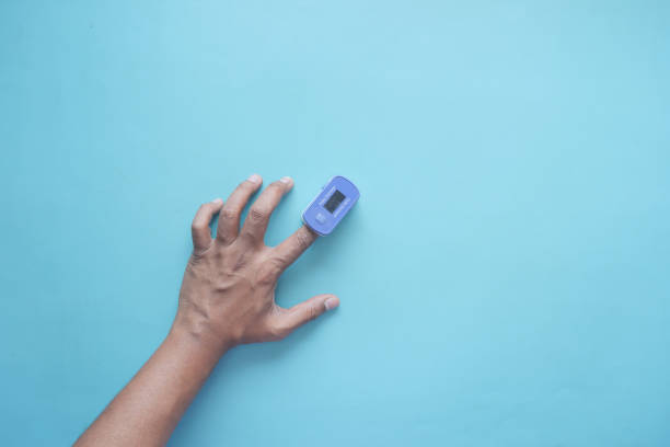 istock close up of man hand using pulse oximeter 1460475104