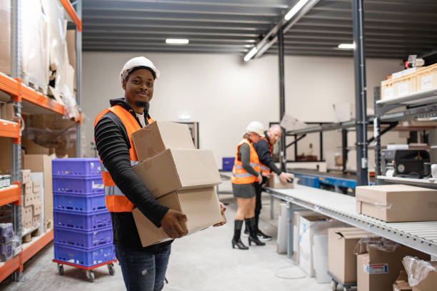 istock A black male warehouse worker on a packing and delivery production line 1460477616