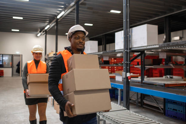 istock A black male warehouse worker on a packing and delivery production line 1460477701