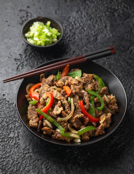 istock Crispy Salt and Pepper Beef in black bowl 1460478837