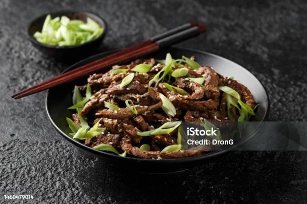 Korean Beef Bulgogi Bbq With Sesame Seeds And Spring Onion Stock Photo - Download Image Now
