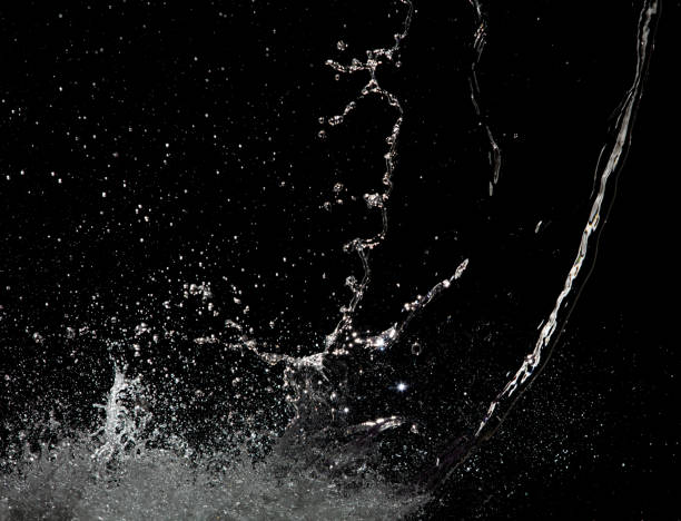 istock Blur Defocus Image of Water hit wall ground, explode into drop droplet. Amount Water attack impact and fluttering in air explosion. Stop motion freeze shot. Splash Water for texture elements 1460481115