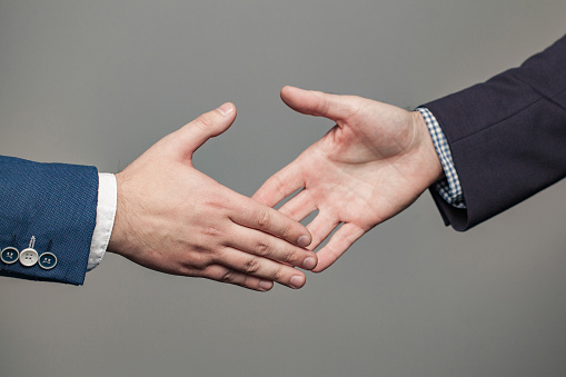 Business people in suit shaking hands, get an agreement, successful business concept