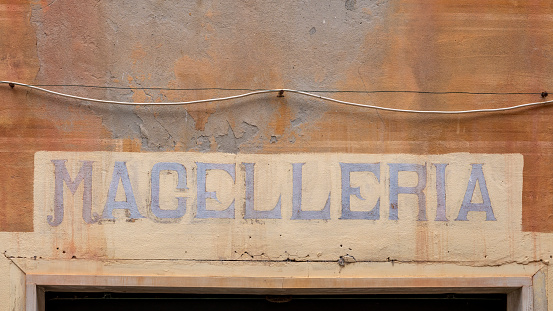 Old sign for a butchers shop in Italy.