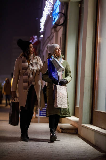 istock Two friends window shopping during Christmas holidays 1460490838