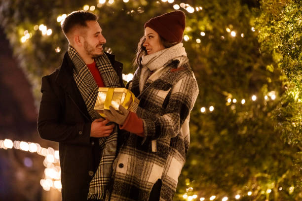istock Caring young man giving his girlfriend a Christmas present 1460491133