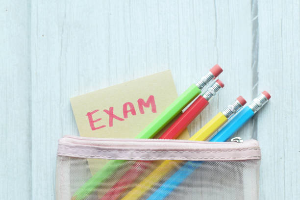 istock exam word in a sticky note and pencils on color background 1460491283