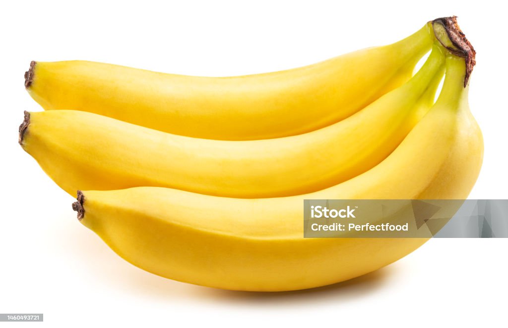 Three perfect ripe yellow bananas isolated on white background. Three perfect ripe yellow bananas isolated on white background. Most popular worldwide fruit. Banana Stock Photo