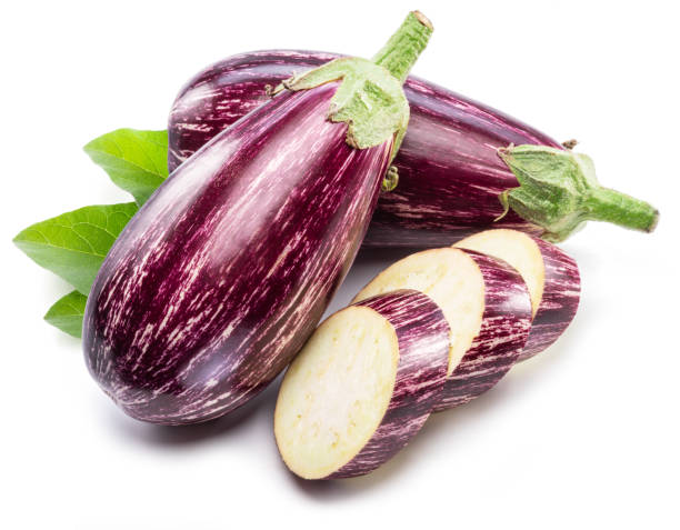 istock Fresh striped aubergines or eggplants with leaf and slices isolated on white background. 1460493775