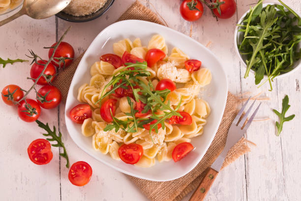 istock Orecchiette pasta with arugula and tomato. 1460494904