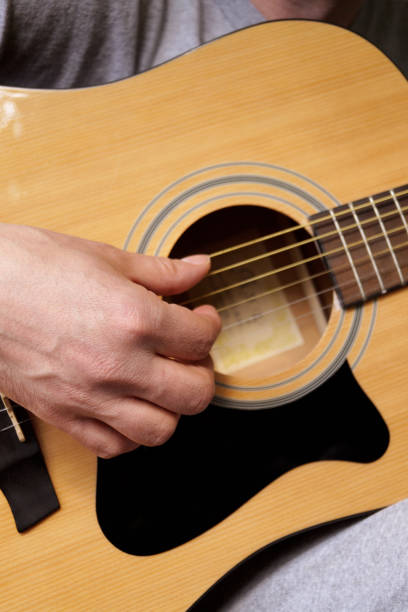 istock Playing the acoustic guitar 1460498742