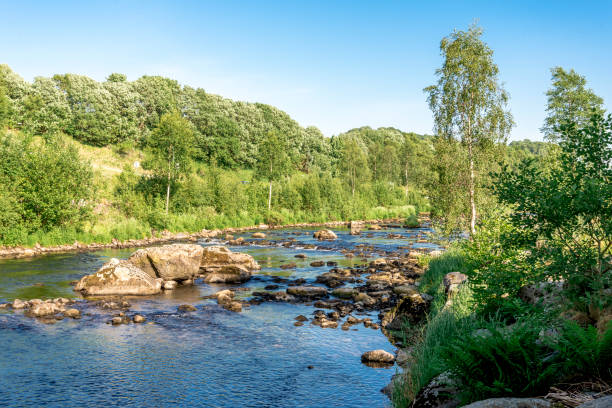 Scenic view of the shallow river rocky ford near Algard town stock photo