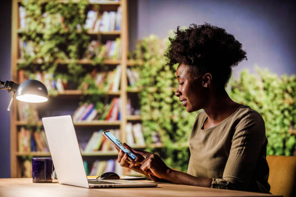 istock Young woman using mobile phone at home office, online shopping. 1460499207
