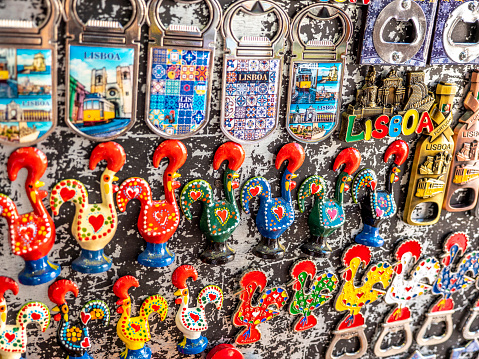 Lisbon, Portugal - August 6, 2019: view of a bunch of Portuguese handcrafted souvenirs made in Lisbon, Portugal and sold on the streets of the city to the tourists representing the most iconic symbols of Portugal.