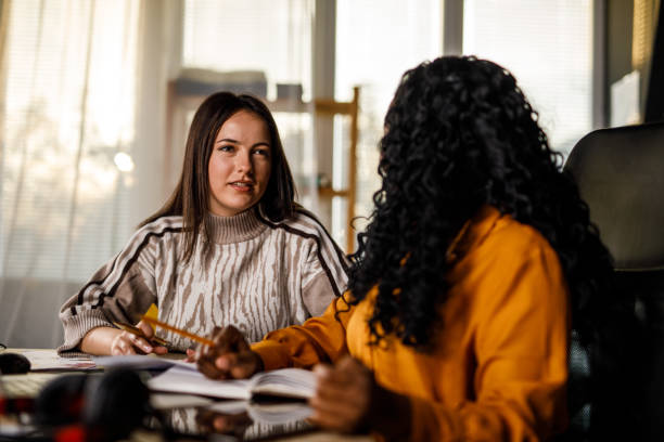 istock Two diverse businesswomen having fun co-working on a project 1460502349