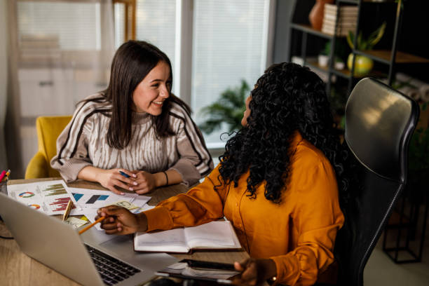 istock Two diverse businesswomen having fun co-working on a project 1460502350