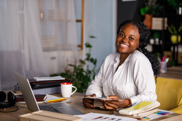 istock Creative designer choosing color swatches for a project and smiling at camera 1460502547