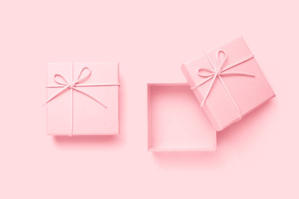 istock Top view of empty open gift box for congratulations on pink background. 1460503989