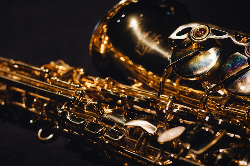 Close-up of intricate details of a shiny saxophone musical instrument