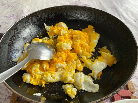 Fresh fried eggs in pan