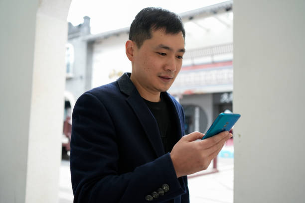 istock Men use mobile phones outdoors 1460509666