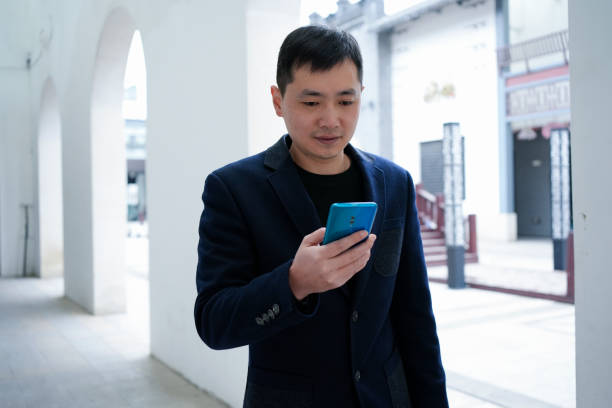 istock Men use mobile phones outdoors 1460509668